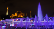 A slow shutter capture of the fountain in Sultanahmet Square with Hagia Sophia in the background.