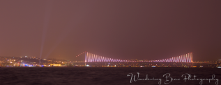 The Bosphorus Bridge glows in the distance with it's many lights that change pattern and color.